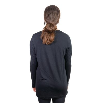 Back shot of Ottie Merino women's black long sleeve merino wool t-shirt on 166cm model who is wearing a size small