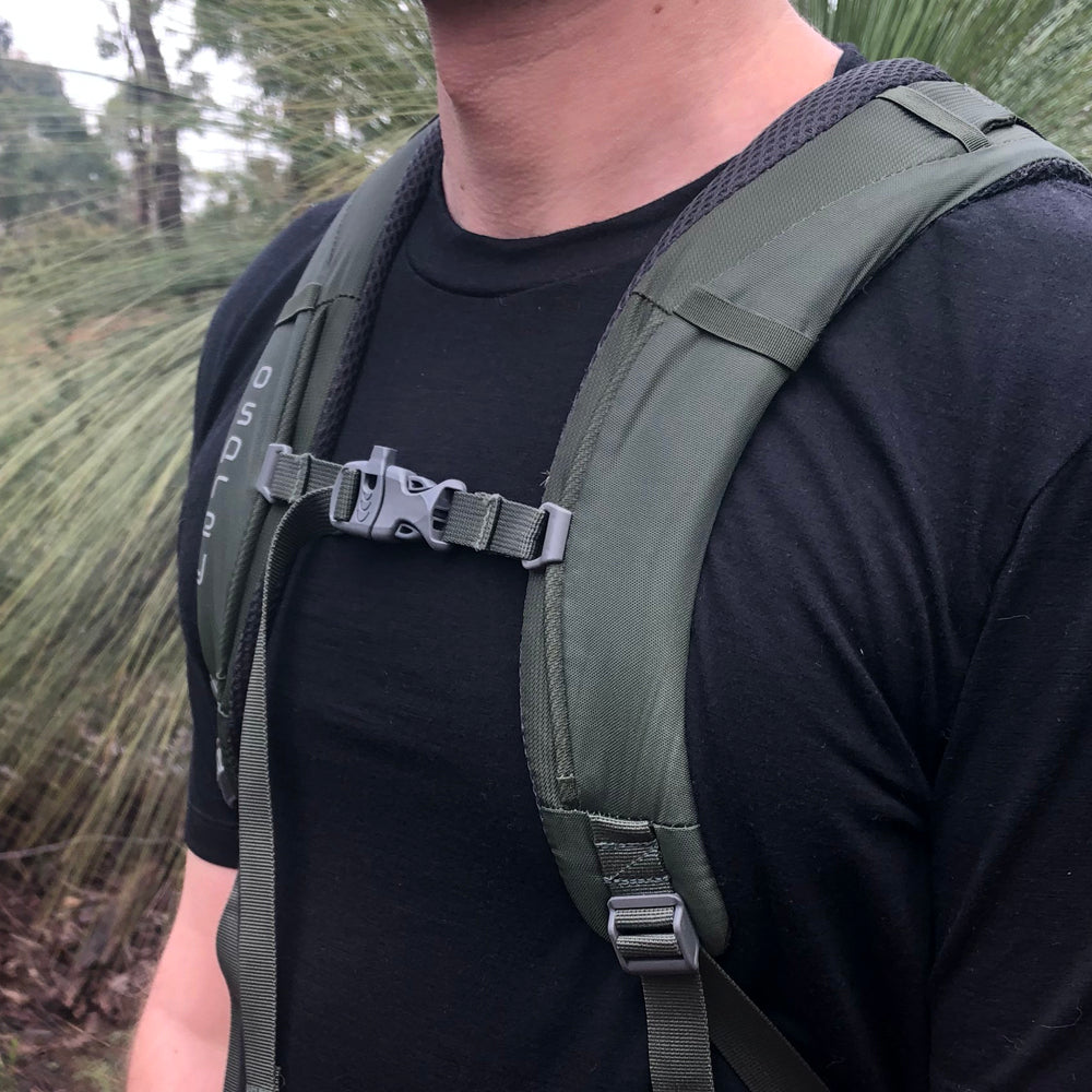 Chest shot of an Ottie Merino wool hiking t-shirt with an osprey backpack.