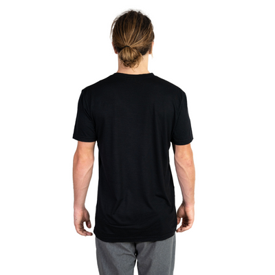 Back shot of Ottie Merino men's black short sleeve merino wool t-shirt on 173cm model who is wearing a size medium