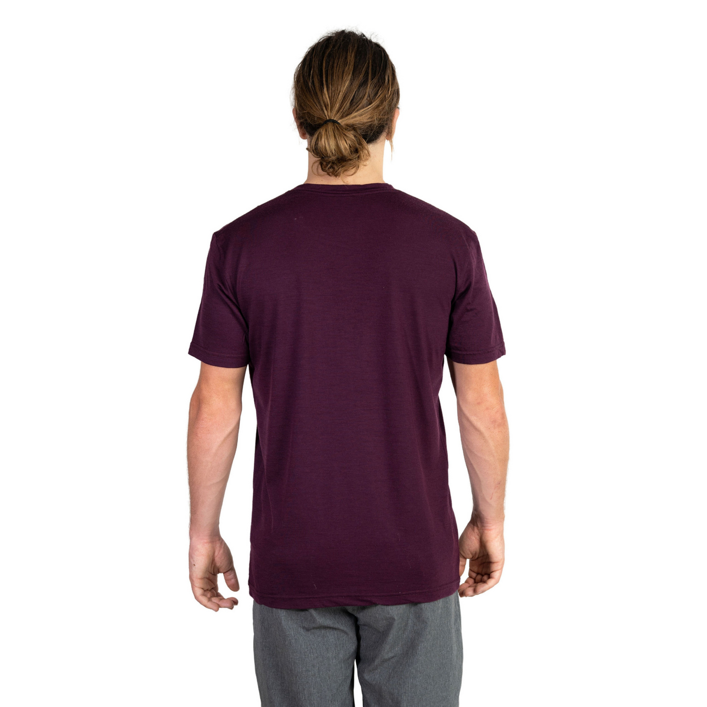 Back shot of Ottie Merino men's Plum short sleeve merino wool t-shirt on 173cm model who is wearing a size medium