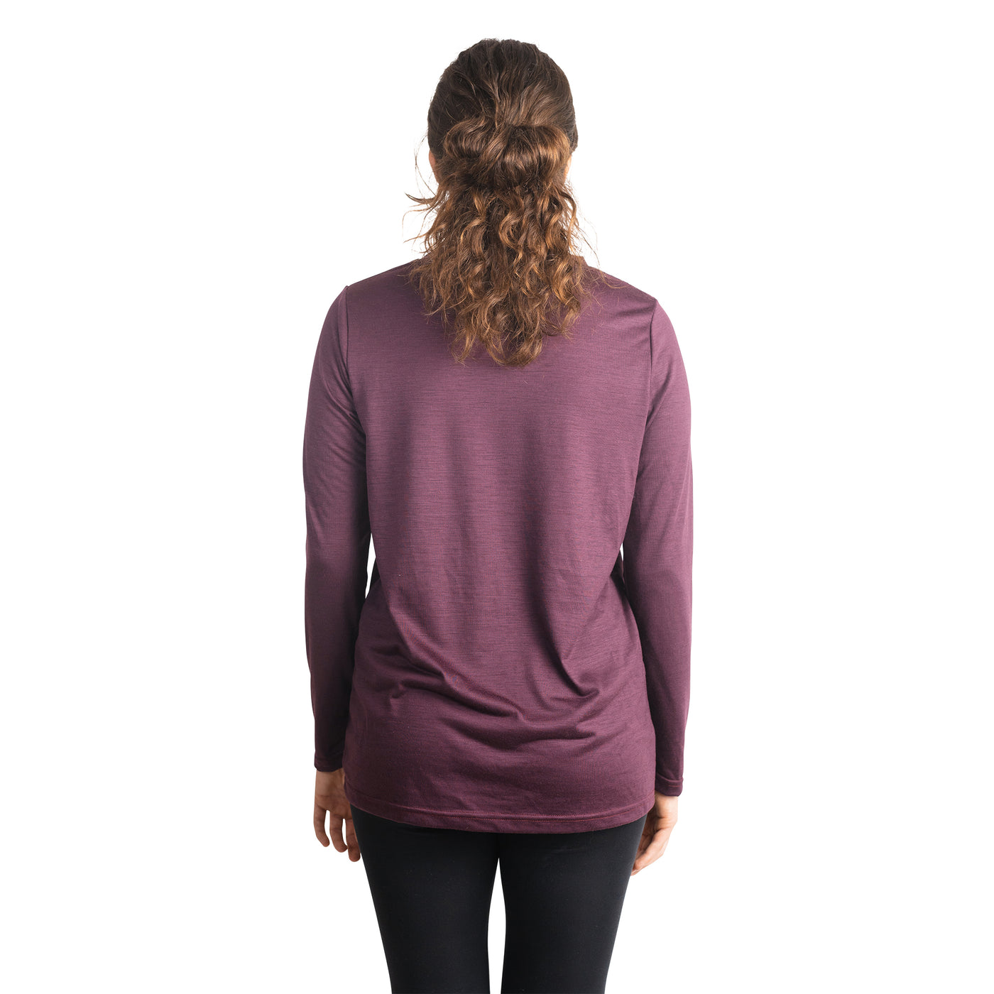 Back shot of Ottie Merino women's Plum long sleeve merino wool t-shirt on 166cm model who is wearing a size small